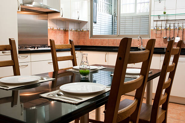 istock Varnished wooden table set for meal with four chairs 151558074