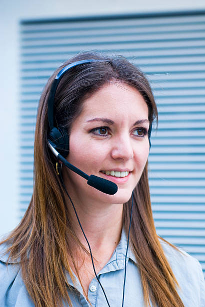 istock pretty woman communicating with headset 151558539