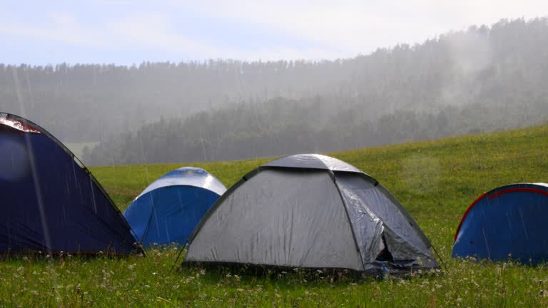 Torrential summer rain caught the tent city of tourists while traveling