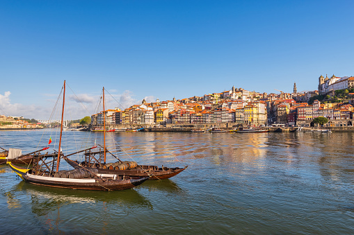 Porto Portugal, city skyline at Porto Ribeira and Douro River with Rabelo wine boat