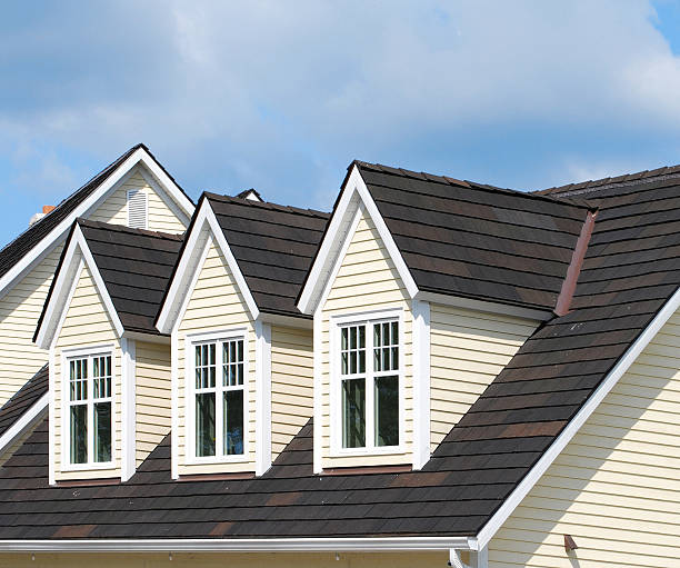 Three Dormers Three dormers on a new house dormer stock pictures, royalty-free photos & images