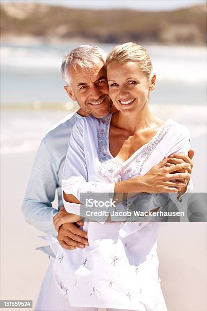 Happy Mature Couple At Beach Stock Photo - Download Image Now - Couple - Relationship, 40-49 Years, Summer