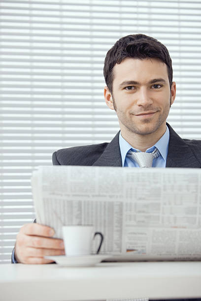 istock Businessman reading newspaper 151559717