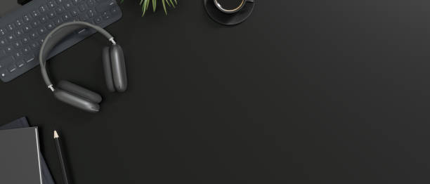 istock Modern creative black workspace top view with headphones, keyboard, stationery, and copy space. 1515598066