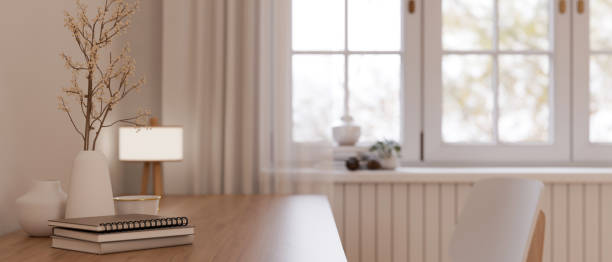 istock A workspace with books, ceramic vases, and table lamp in a beautiful minimalist room. 1515599135