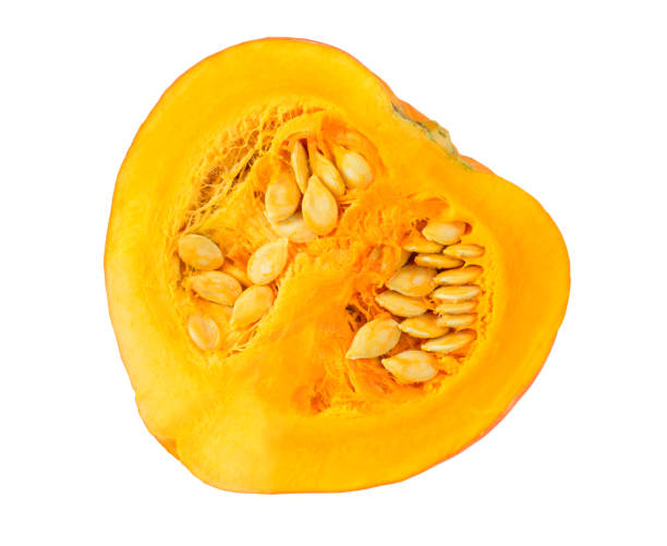 istock Half of cut orange pumpkin with seeds isolated on white 1515606247