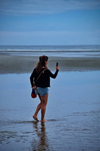 istock Woman walking on the beautiful beach 1515632604