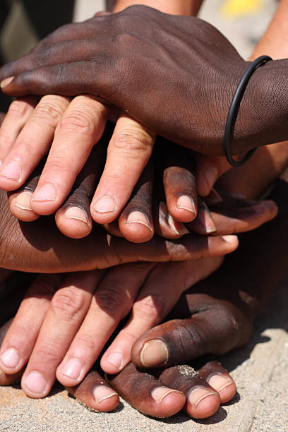 istock Numerous people's hands stacked on top of each other 151563931
