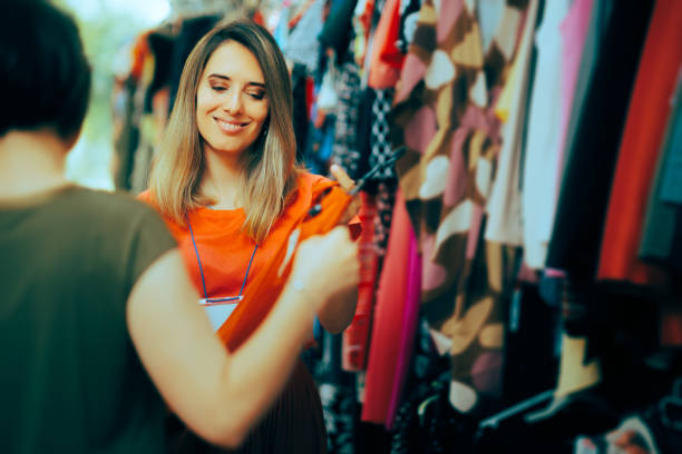 Three beautiful girls with shopping bags in shop