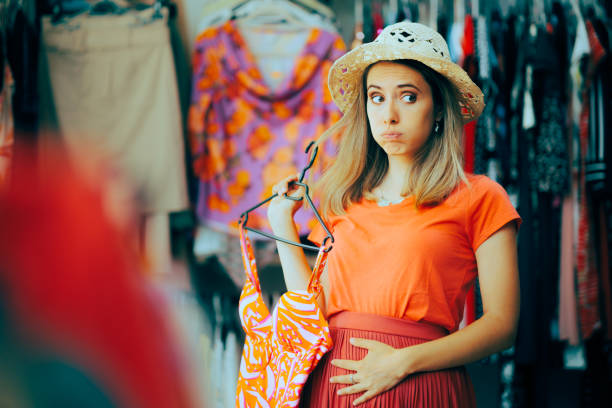 istock Woman Feeling Bloated Thinking and Choosing a Bathing Suit 1515643158