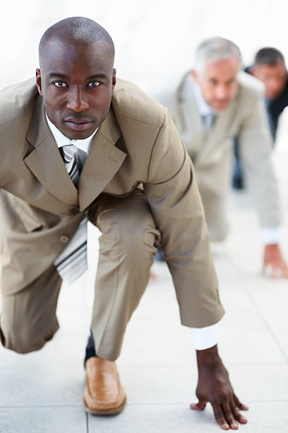 istock Business colleagues lined up getting ready for race 151564860