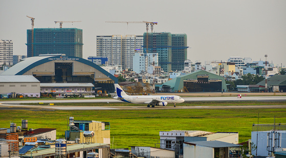 Saigon, Vietnam - Mar 11, 2018. Aircrafts on runway at Tan Son Nhat Airport in Saigon (Ho Chi Minh City), Vietnam.