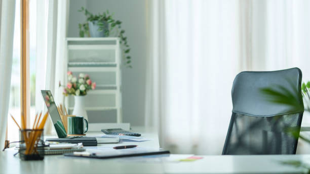 istock Moder workplace with computer, coffee cup, books and office supplies on white table. 1515660438