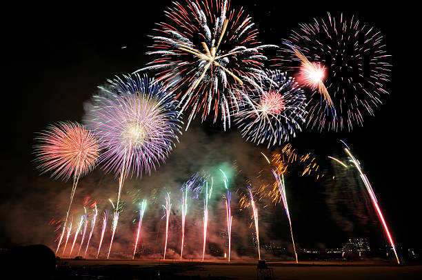Line of colorful fireworks bursting in the sky in Japan stock photo