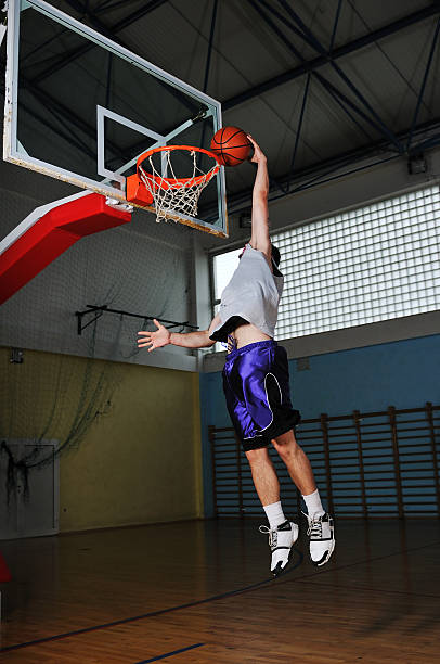 istock basket ball game player at sport hall 151568537