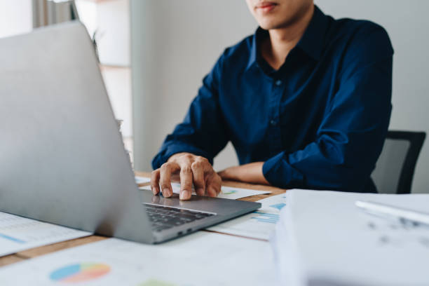 istock Businessman using computer laptop with planning working on financial document, tax, exchange, accounting and Financial advisor. 1515687875