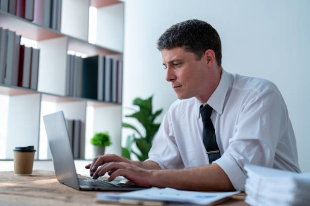 istock Office person lifestyle while busy working on desk 1515694730