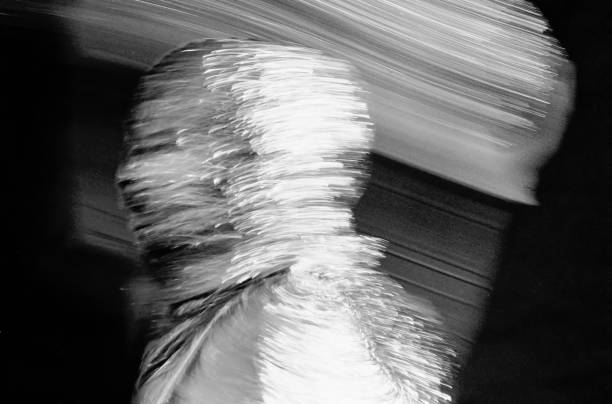 istock reflection of a man in motion dressed with silver foil in black and white 1515699294