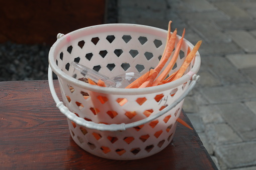 pet food basket filled with carrots and seeds