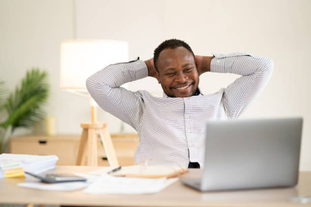 istock Office man worker cheerful smiling comfortable sit resting at office desk 1515710326