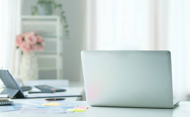 istock Laptop computer, coffee cup and financial document on office desk. 1515722902
