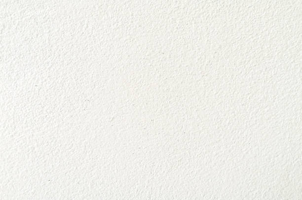 white cement; texture stone concrete,rock plastered stucco wall; painted flat fade pastel background grey solid floor grain.Rough top beige empty brushed print sand brick sepia grunge crack home dirty