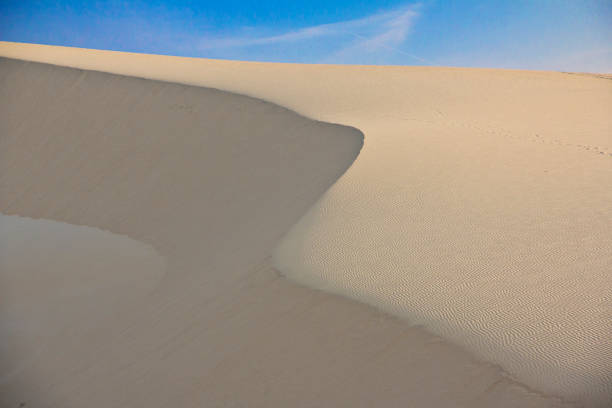 istock White Sad Dune with blue sky at Muine, Vietnam 1515730731