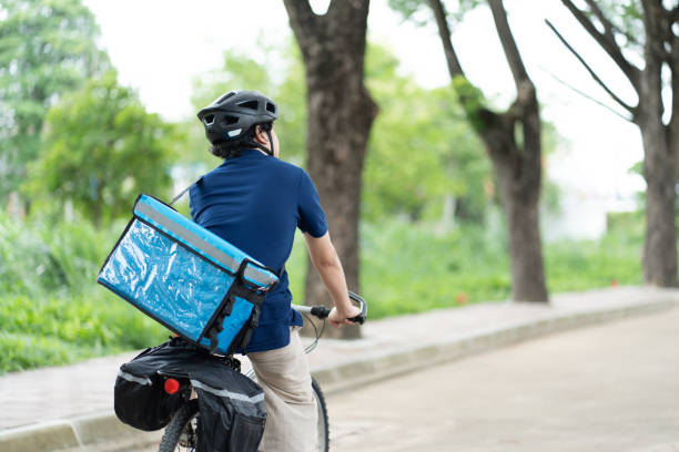 istock Delivery food by bicycle courier thermal box 1515760806