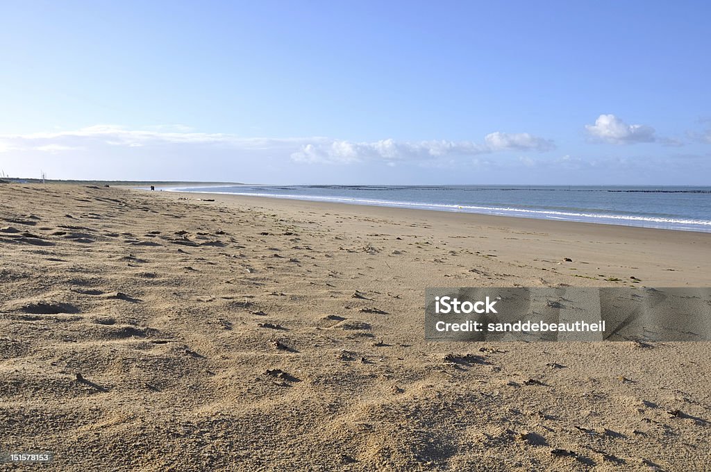 sandy beach large expanse of sand leading to the sea and under the blue sky Atlantic Ocean Stock Photo