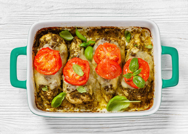 istock chicken breasts with pesto sauce, cheese, tomato 1515785764