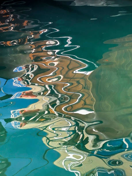 Reflection of wooden yacht