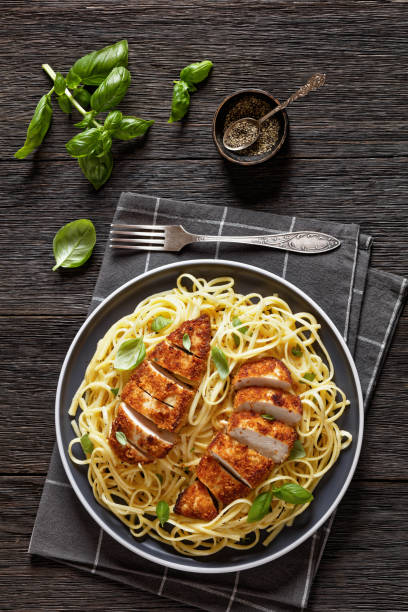 istock crusted chicken over lemon butter pasta, top view 1515789895