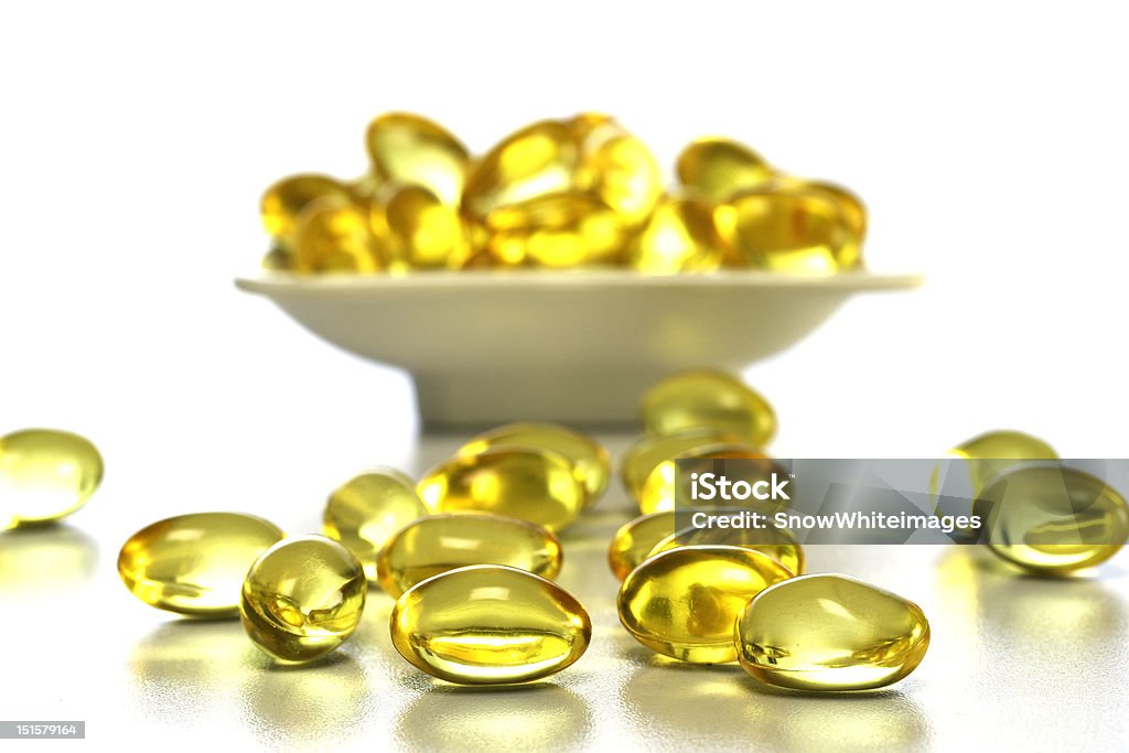 Cod liver oil nutritional supplements pills Vitamin E pills Capsule - Medicine Stock Photo