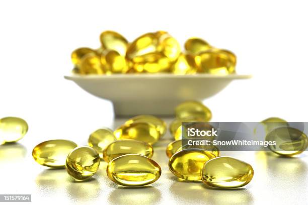 Cod Liver Oil Nutritional Supplements Pills Stock Photo - Download Image Now - Capsule - Medicine, Cod Liver Oil, Dose