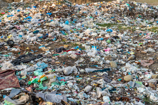 istock large garbage pile closeup. Global warming and pollution concept. 1515804945