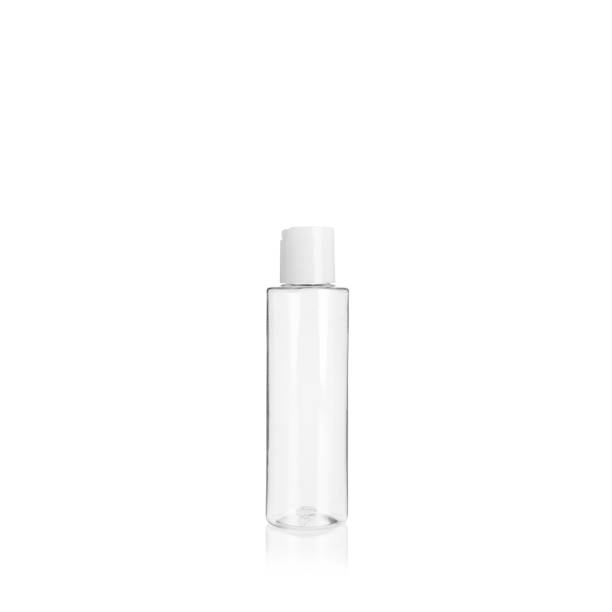 istock Transparent cylindrical PET bottle container with white cap. Packaging of antiseptic. Template of a bottle for cosmetics and medical products. Isolated on white background, copy space template, banner. 1515851576
