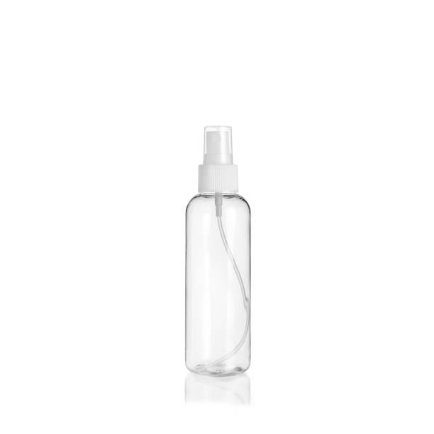 istock Transparent rounded cylindrical PET bottle container with spray pump on white background. Packaging of antiseptic. Template of a bottle for cosmetics and medical products. 1515852851