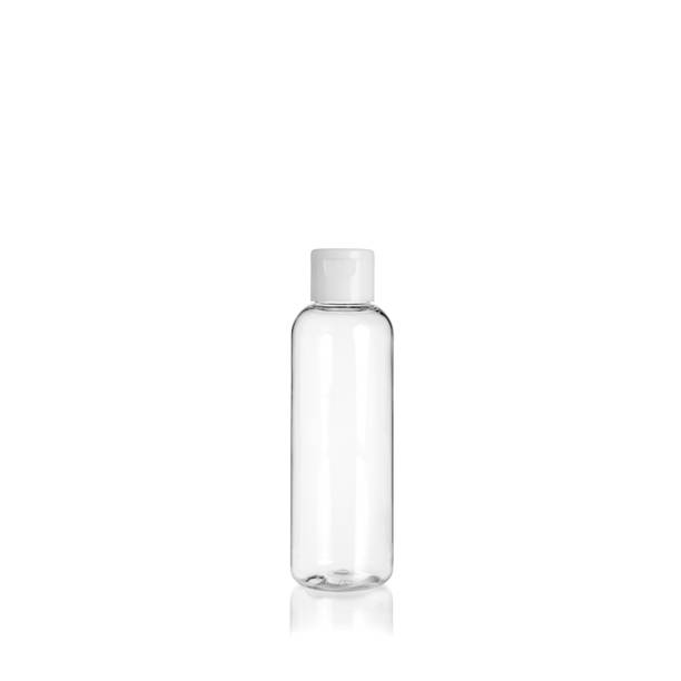istock Transparent rounded cylindrical PET bottle container with orange spray pump on white background. Packaging of antiseptic. Template of a bottle for cosmetics and medical products. 1515853112