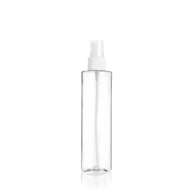 istock Transparent cylindrical PET bottle container with white spray pump. Packaging of antiseptic. Template of a bottle for cosmetics and medical products.  Isolated on white background, copy space template, banner. 1515854150