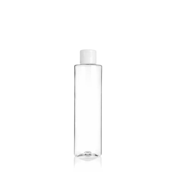 istock Transparent cylindrical PET bottle container with white cap. Packaging of antiseptic. Template of a bottle for cosmetics and medical products. Isolated on white background, copy space template, banner. 1515854154