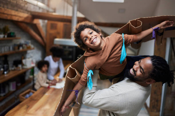 istock Single black father having fun with his little son at home. 1515863585