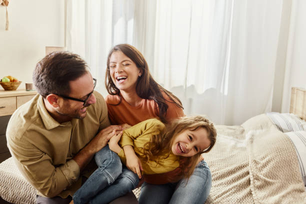 istock Young cheerful family having fun in bedroom. 1515879268