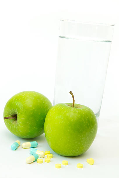 istock Green apple with slimming pills 151593766