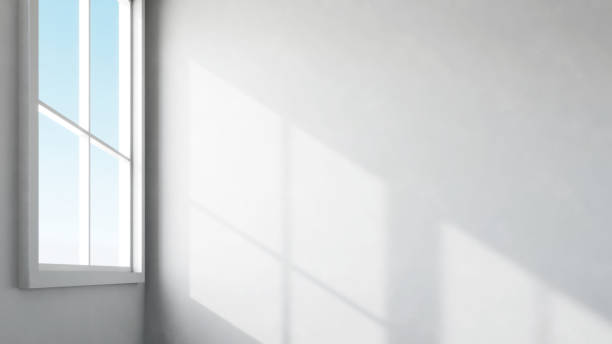 istock View of sunlight shadow through the window on concrete wall. 1515947207