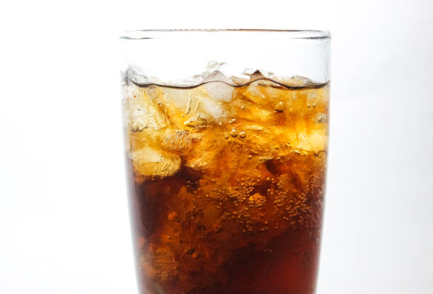 istock a glass of cold cola with ice cubes, isolated on a white background 1515948507
