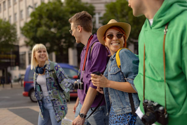 istock Young happy tourists having fun while taking a walk on the street. 1515973366
