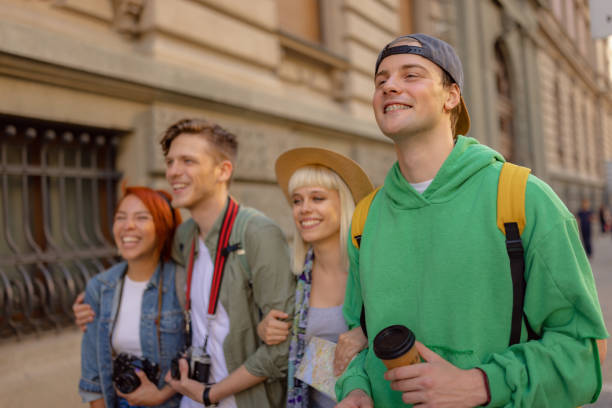 istock Group of happy friends having fun while exploring the city. 1515980705