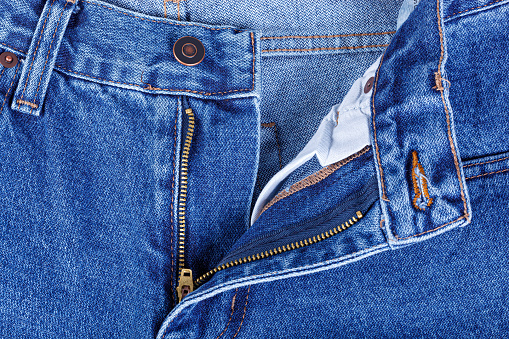 A pair of jeans with the fly opened and clipping path.