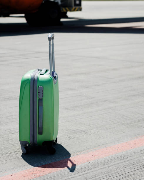 istock lonely luggage on wheels 1516016694