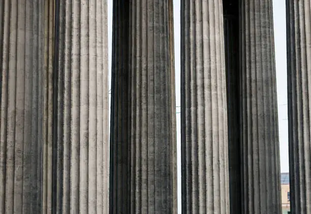 Photo of antique columns of old architecture.